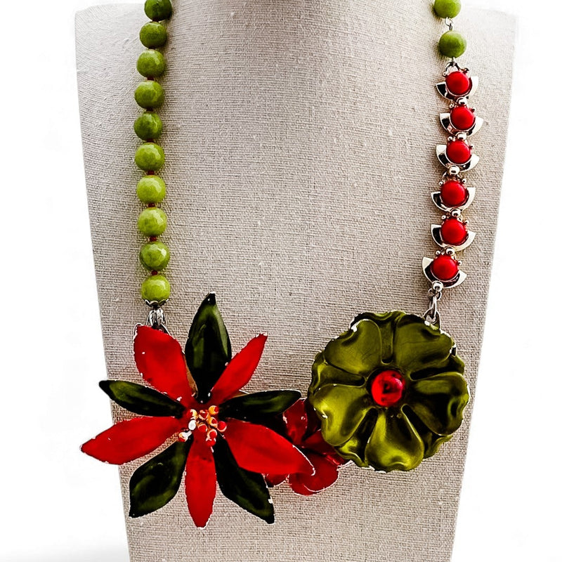 Necklace with floral pendants on a mannequin bust against a white background