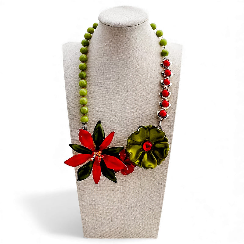 Necklace with floral pendants on a mannequin bust against a white background
